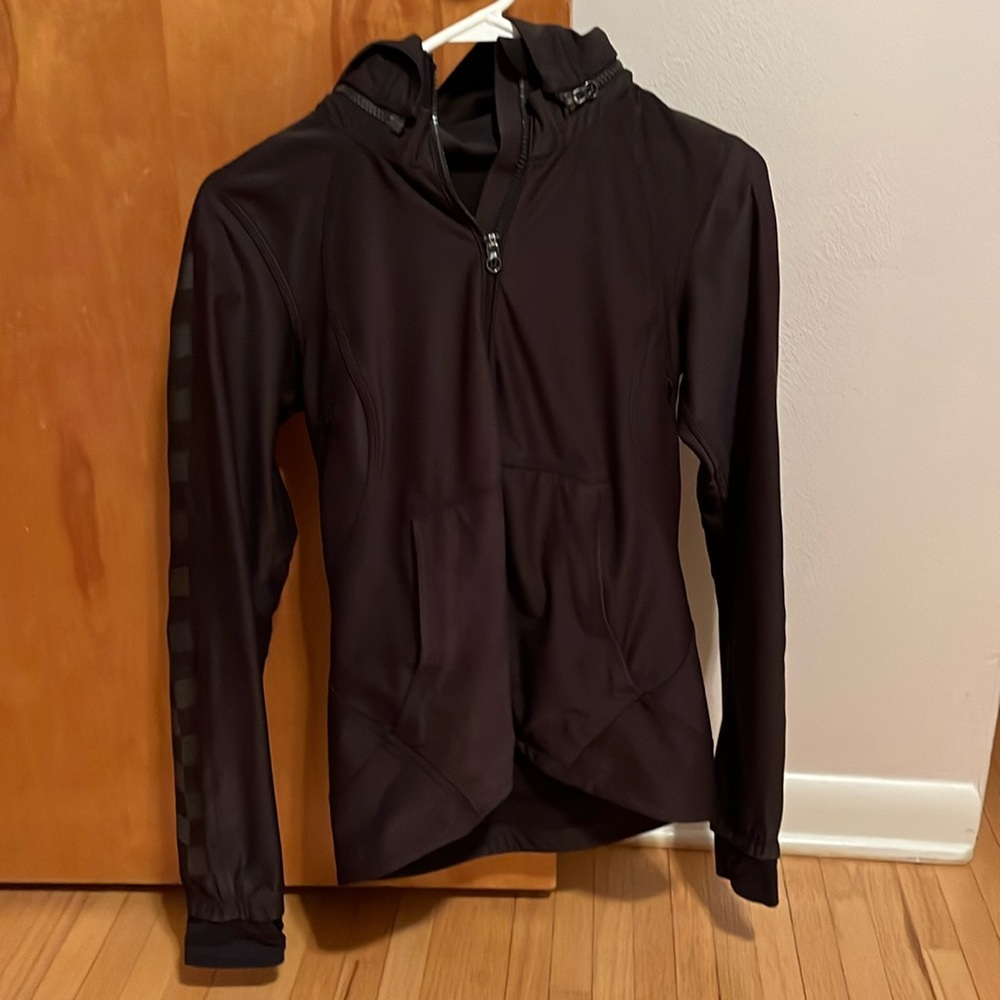 Lululemon women’s black jacket with detachable hood.  Excellent condition